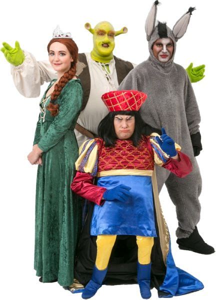 Group Of People In Costume Standing Next To Each Other