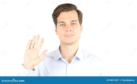 Young Man Says Hello In Camera Isolated White Background Stock Image