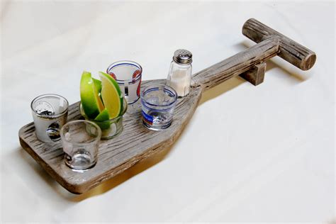 This is a cool way to store shot glasses. Boat Oar Shot Glass Holder- $24.99 | Shot glass holder