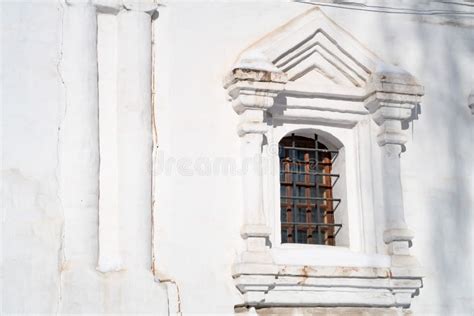 Arched Window In A Brick White Stone Wall Of A Temple With A Stone