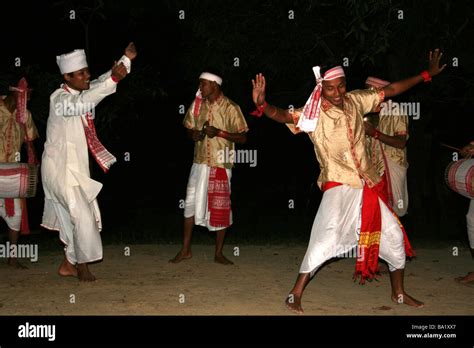 Assamese Men In Traditional Dress Performing A Vibrant Bihu Dhol Stock
