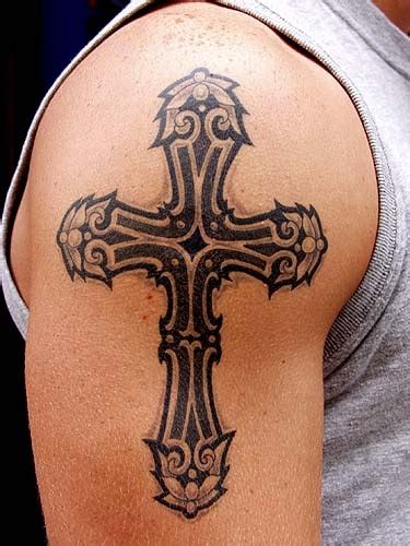 Cross tattoos on back shoulder. 22 Beautiful Tribal Cross Tattoos