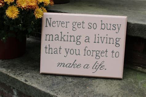 Wooden Sign With The Quote Never Get So Busy Making A Living That You