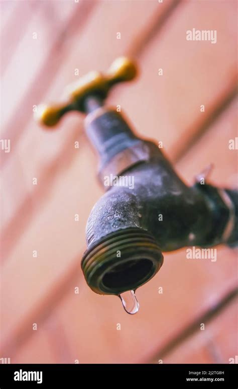 Drop Of Water Leaking Out Of Tap Or Faucet Stock Photo Alamy
