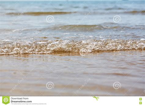 Little Ripples In The Sand From The Water On The Beach Stock Photo