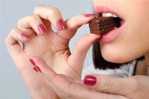 Woman Eating Chocolate Adobestock 110371958  Maple Ridge Farms