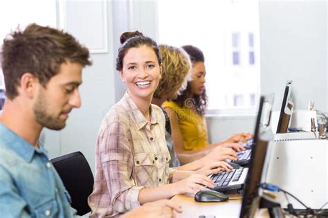 Student Smiling At Camera In Computer Class Stock Photo Image Of Four