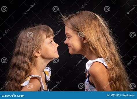 Two Girls Look At Each Other Face To Face Stock Image Image Of Hair