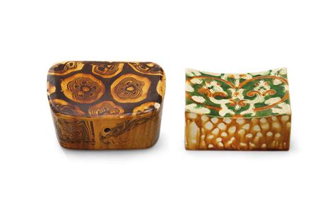 An Incised Sancai Pillow And An Amber Glazed Marbled Pillow