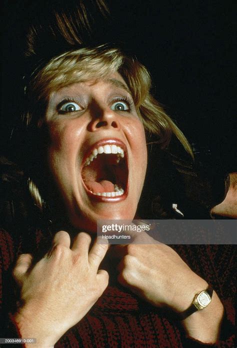 Woman Grasping Throat Mouth Wide Open Photo Getty Images