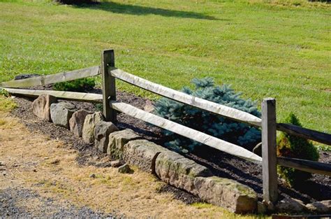 This type of fencing has been in use for centuries and continues to be popular today on ranches, farms and in rural residential use. Rocks and hard places | Split rail fence, Fences and Driveways