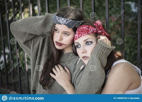 Portrait Of Two Girls Outdoors The Concept Of Difficult Teenagers Bad