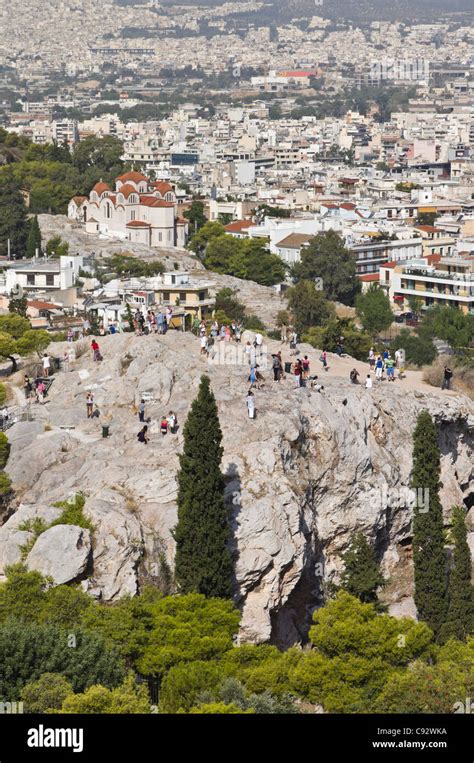 Athens Tourists Clamber Around On The Rock Of Mars Hill The