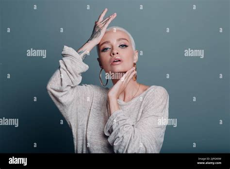 Millenial Young Woman With Short Blonde Hair Portrait Doing Face Yoga Self Facebuilding Massage