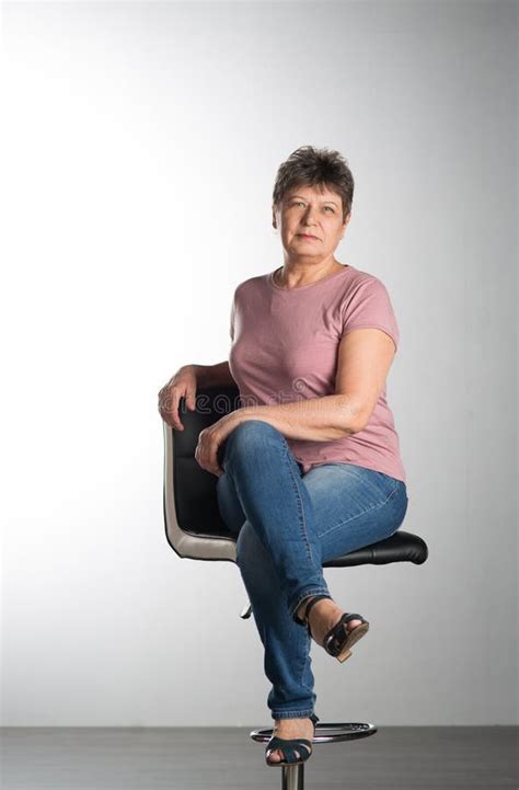 Elderly Woman Sitting On A Chair Stock Image Image Of Person Female