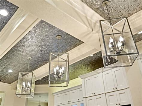 Unscrew any light fixtures, fans, or air vent covers. Lantern Pendants Light Hanging From Tin-Tiled Ceiling | HGTV