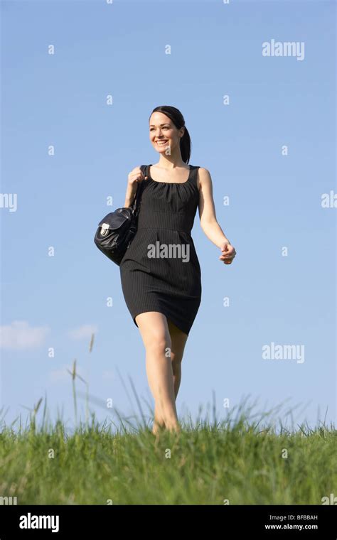Woman Walking Through Summer Countryside Stock Photo Alamy