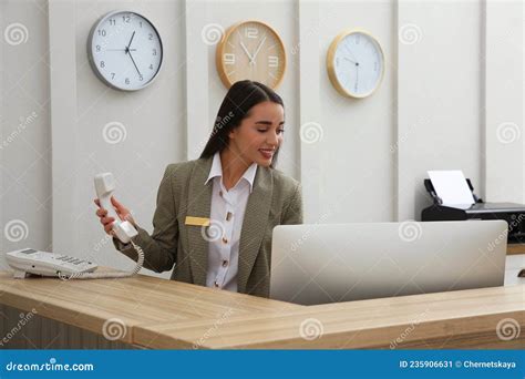 Beautiful Receptionist Working At Counter In Hotel Stock Image Image