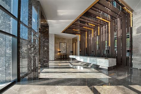 Marble Covers Almost Every Surface In This Striking Office Lobby
