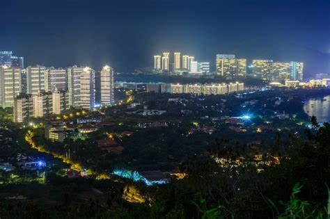 Premium Photo Night View Of Sanya City With Bright Multi Colored