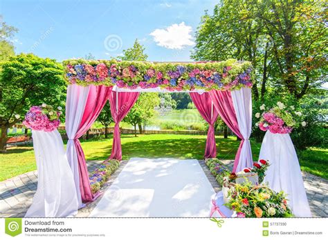 Beautiful Wedding Arch With Flowers In Garden Stock Photo