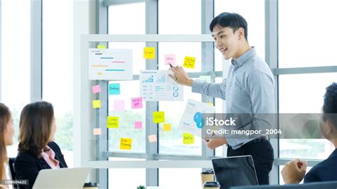 Businessman Presenting Business Plan Information At Office Meeting