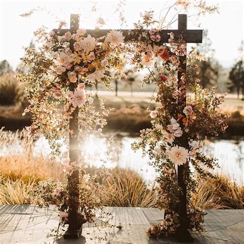 Oh We Are Simply Swayed By This Stunning Ceremony Set Up Incorporating Wild Flower Arrangeme