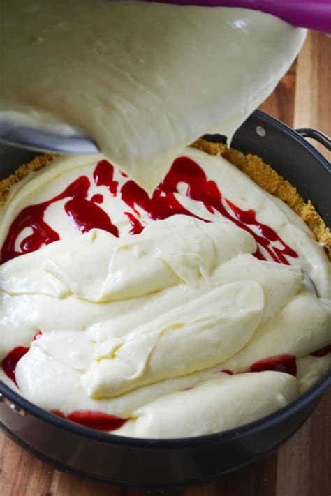 Mine did develop a couple of cracks on top, but it was not very visible thanks to the design. White Chocolate Raspberry Cheesecake Recipe | A Wicked Whisk