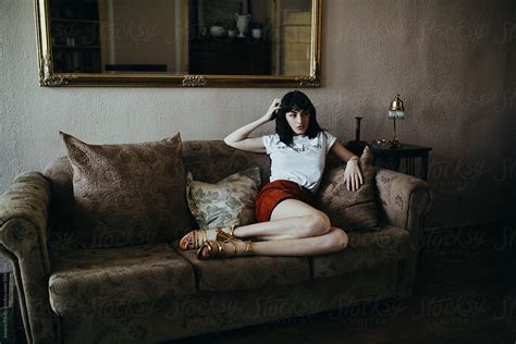Fashionable Woman Sitting On Sofa By Stocksy Contributor Jovana Rikalo Stocksy