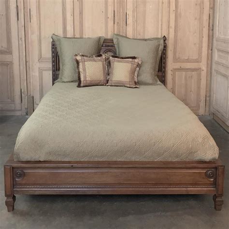 5 years warranty on purchase of any beds. Antique French Walnut Neoclassical Queen Bed at 1stdibs
