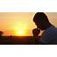 Silhouette Of A Man Praying At Sunset Concept Religion 