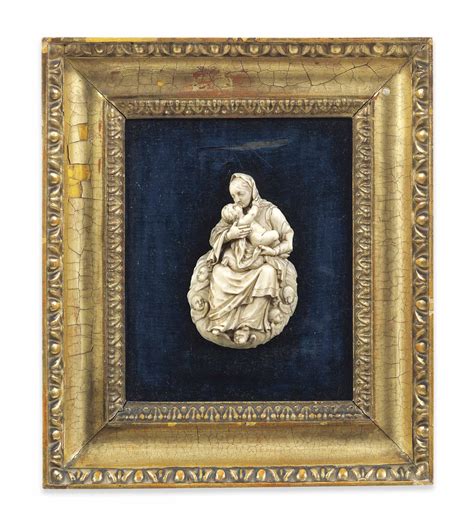 A Carved Ivory Relief Of The Madonna And Child