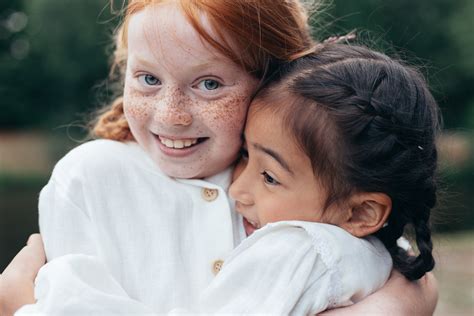 Two Girls Hugging Photos By Canva