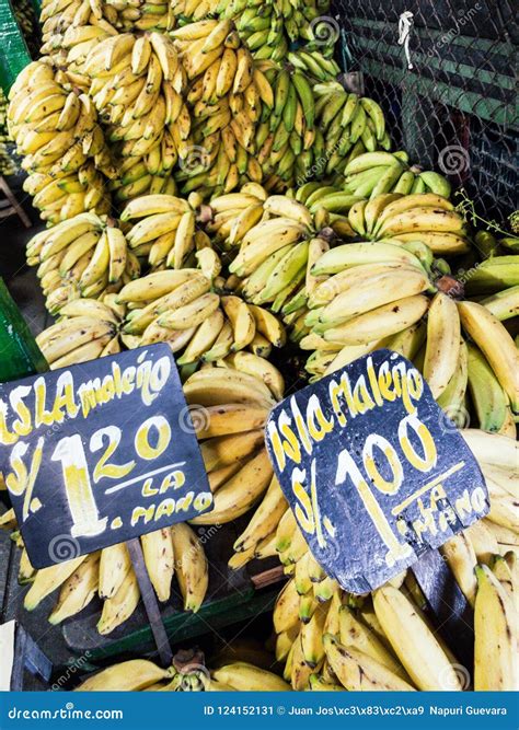 Sale Of Bananas In The Market With Signs That Say The Type Of Banana