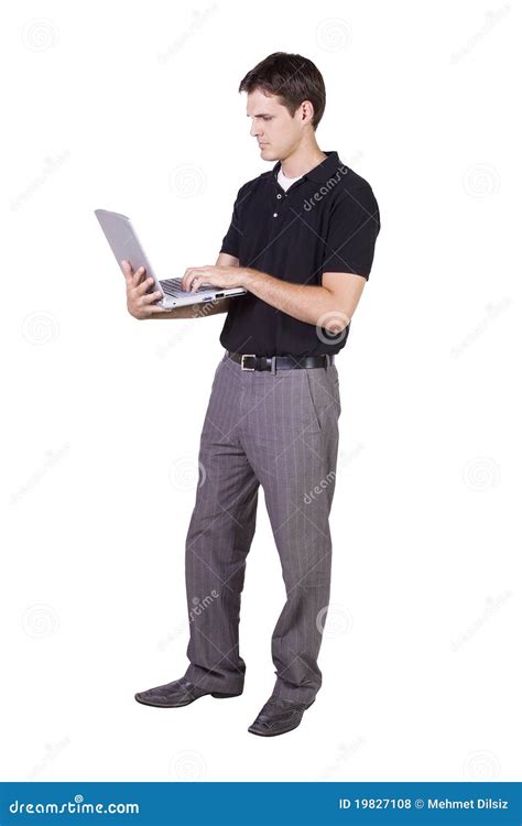 Young Man Standing And Working On Laptop Royalty Free Stock Photos