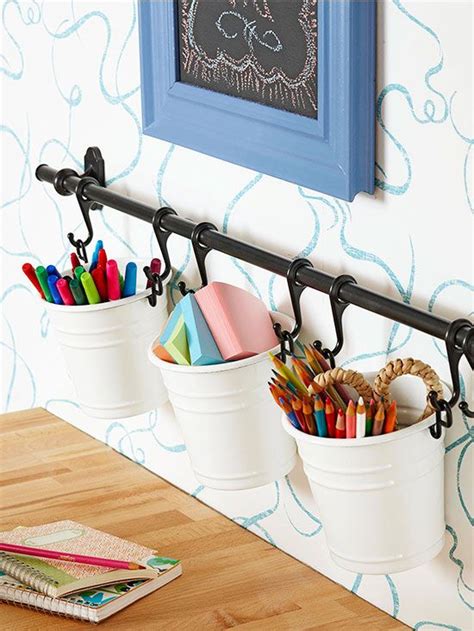 Check out our do it yourself craft selection for the very best in unique or custom, handmade pieces from our shops. Organize craft supplies with a towel rod and small buckets. | http://www.bhg.com/decorating/do ...