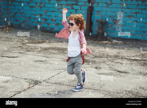 Cute Little Hipster Boy Running Away Stock Photo Alamy