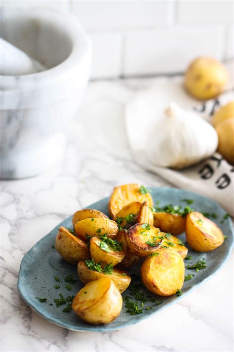 Chop the potatoes into chunks and place them in a big mixing bowl. The Best Garlic Roasted Potatoes (ever!) - Eat, Live, Run