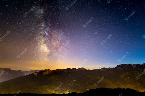 Premium Photo The Colorful Glowing Milky Way And The Starry Sky Over