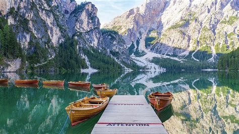 Lago Di Braies Boats Photograph By Michael Levesque Pixels