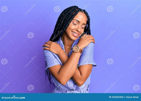 Beautiful Hispanic Woman Wearing Casual Clothes Hugging Oneself Happy And Positive Smiling