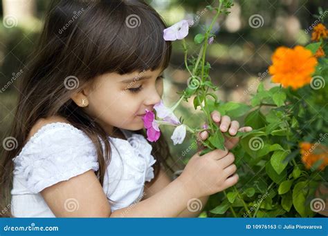 Beautiful Curious Girl In A Garden Stock Image Image Of Outdoors