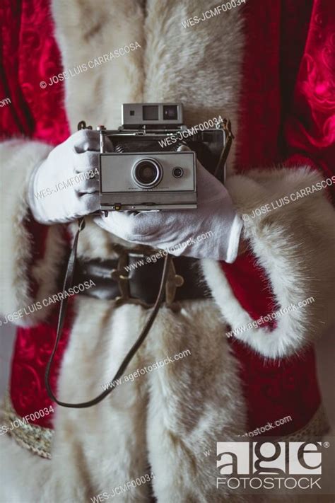 Santa Claus With Vintage Camera Partial View Stock Photo Picture And