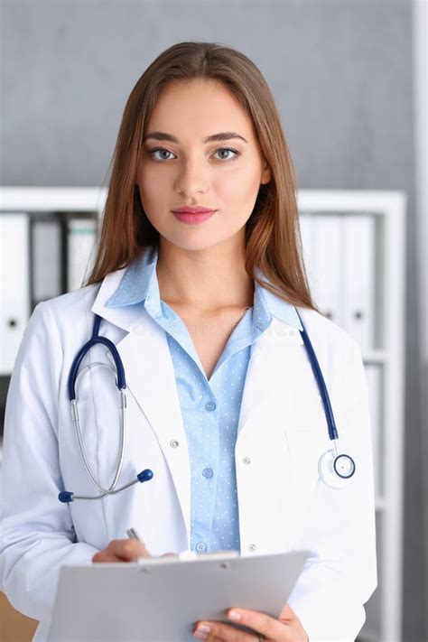 Beautiful Smiling Female Doctor Stand In Office Stock Photo Image Of