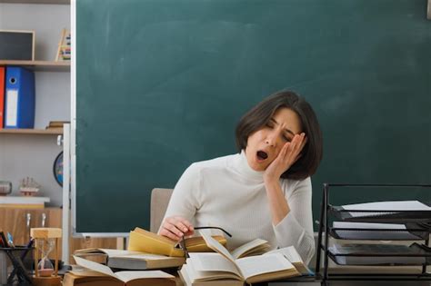 Premium Photo Tired Yawning With Closed Eyes Young Female Teacher