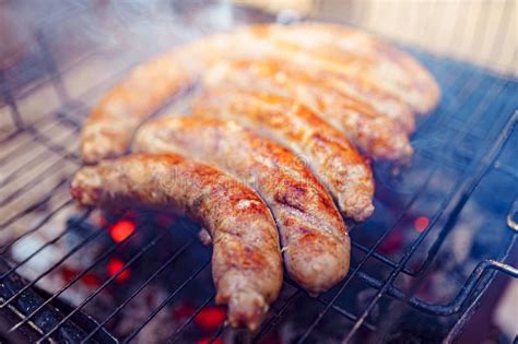 Grilled Sausage On The Picnic Flaming Grill Stock Photo Image Of Meal