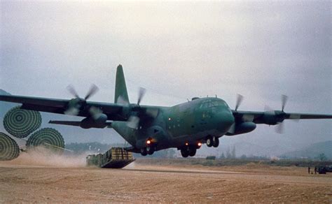 When the load is clear of the plane, cargo parachutes inflate and lower the load to the ground. C-130 Hercules 60-Year Anniversary | Defense Media Network