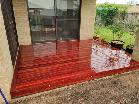 This type of decorative refinishing can be done on driveways, patios, pool decks and even indoor floors. Merbau decking over concrete slab | Bunnings Workshop ...