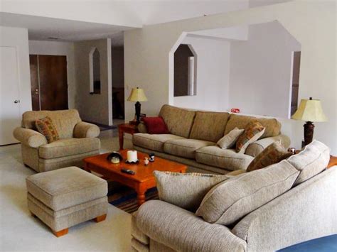 But because the furniture has been placed in a nice conversational grouping in one corner, people can easily walk through the room past the furniture at an angle across the carpet. From Divided Living Room to Elegant Open Floor Plan | DIY