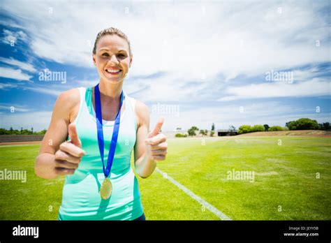 Portrait Of Female Athlete Showing Thumbs Up Stock Photo Alamy